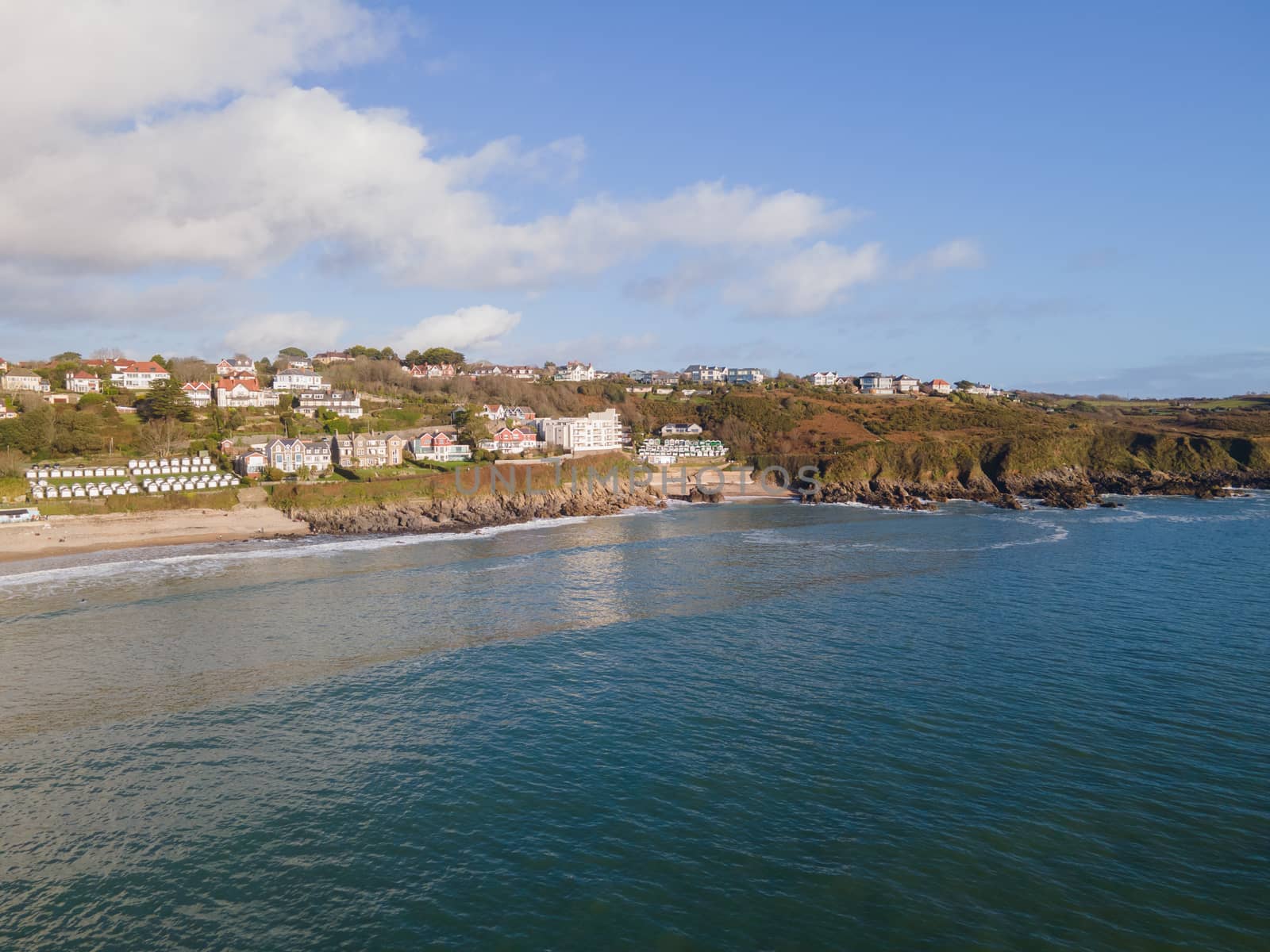 Looking Into Langland Bay in Gower, Wales, UK from the sea on a clean late Autumn day. Blue skies with some clouds by WCLUK