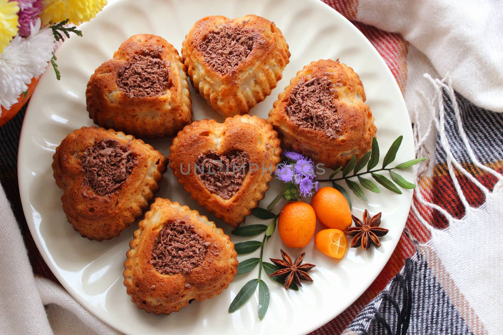 Homemade heart shaped pastries decorated with grated chocolate.Texture or background