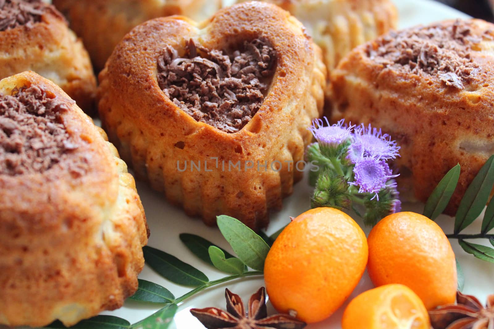 Homemade cupcakes in the shape of a heart and sprinkled with grated chocolate