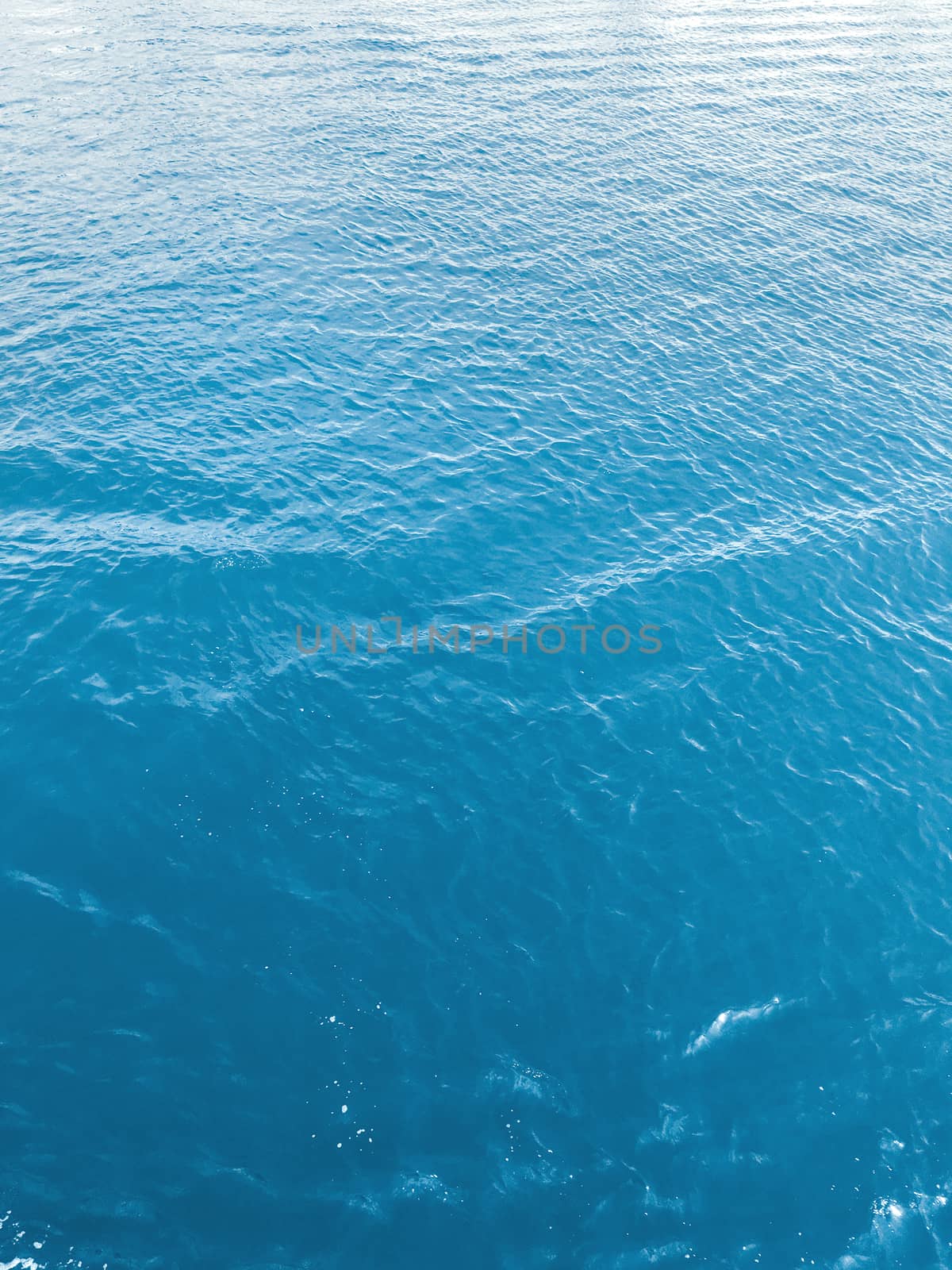 Blue water with foam waves. Deep sea. Peaceful ocean. Abstract n by aksenovko