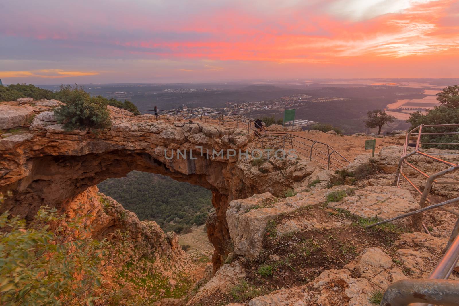 Sunset view of the Keshet Cave, a limestone archway spanning the remains of a shallow cave, in Adamit Park, Western Galilee, Northern Israel