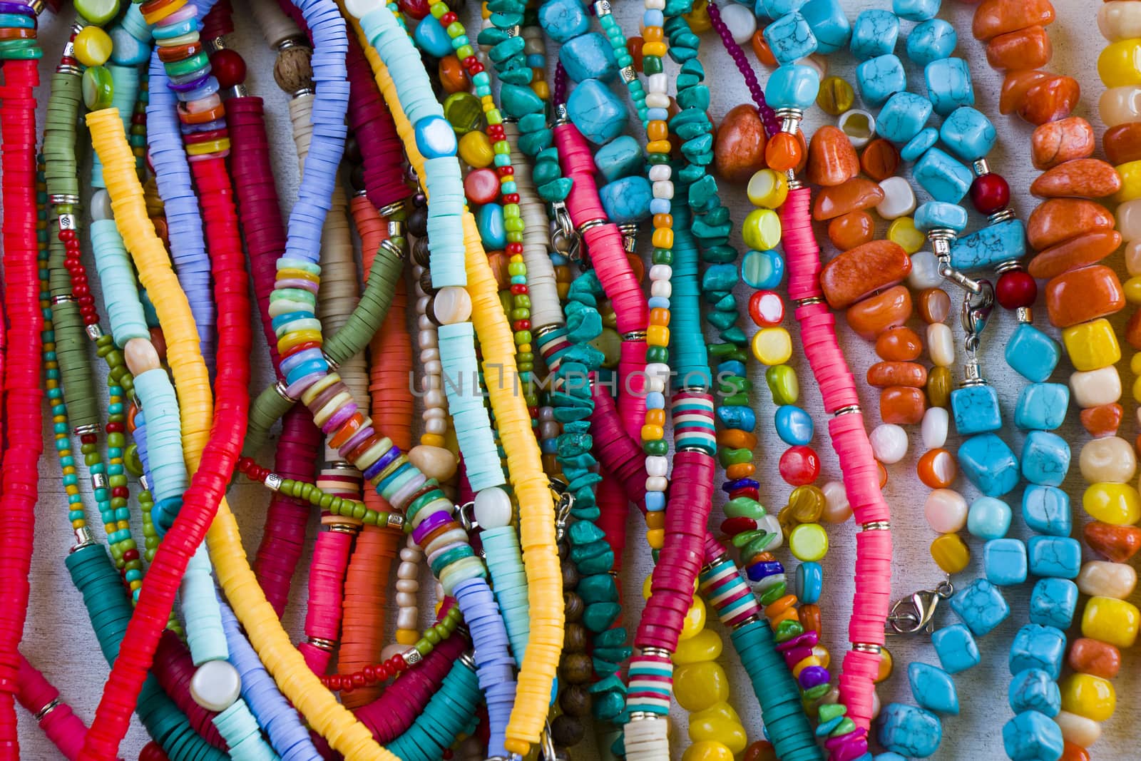 Jewelry background, colorful necklaces, large group of beads and stone necklace by Taidundua