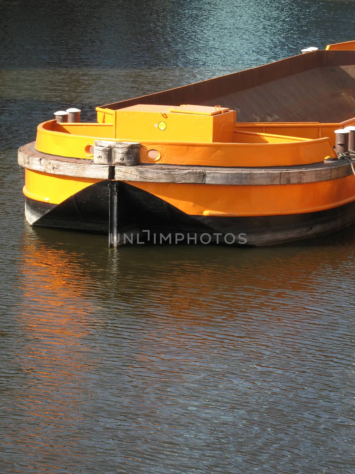 Empty barge waiting for a load in the Alsterfleet near the street called Herrlichkeit, Hamburg, Germany.