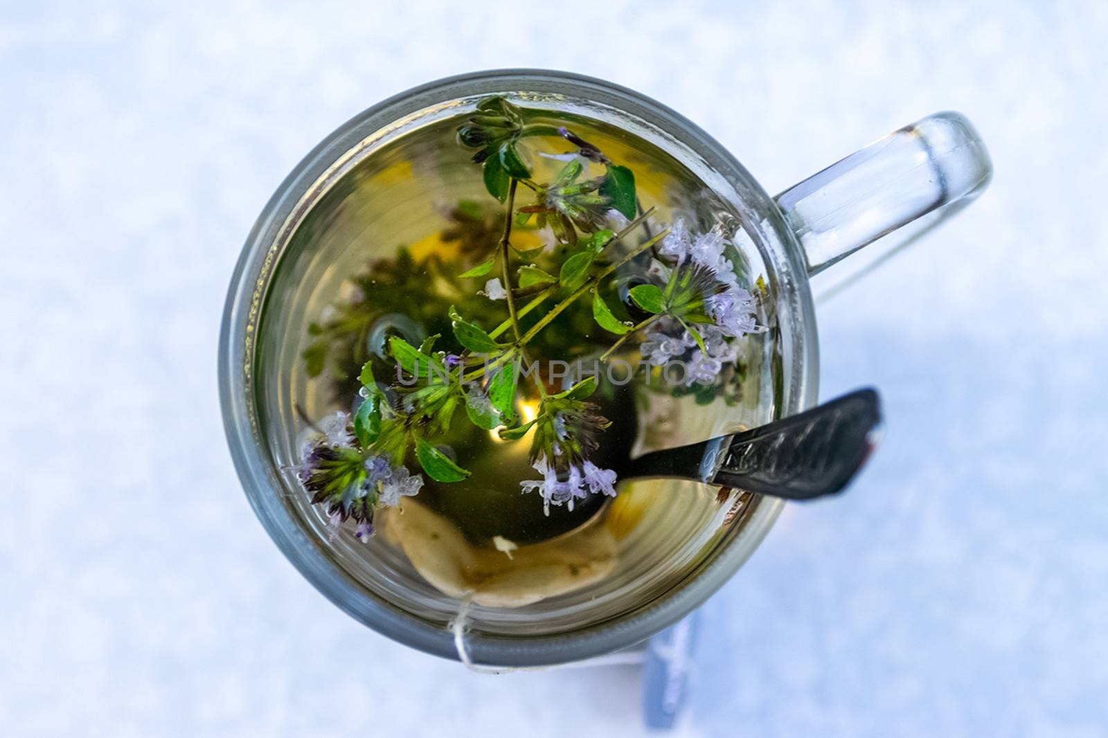Transparent mug with tea. Brewing tea in bag. Brewing herbal tea. Herbal tea. by DePo
