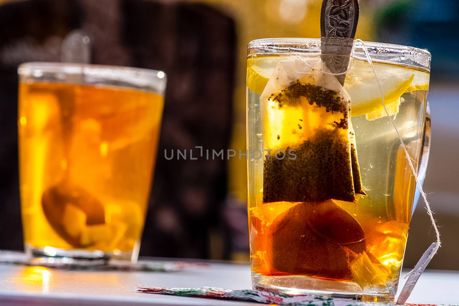 Transparent mug with tea. Brewing tea in a bag.