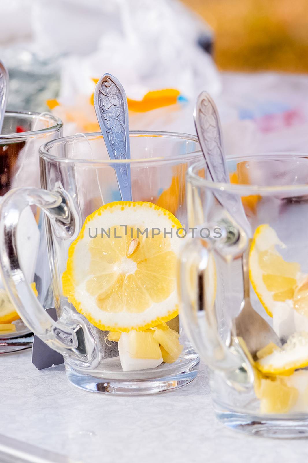 Transparent mug with tea. Brewing tea in a bag. Tea with lemon.