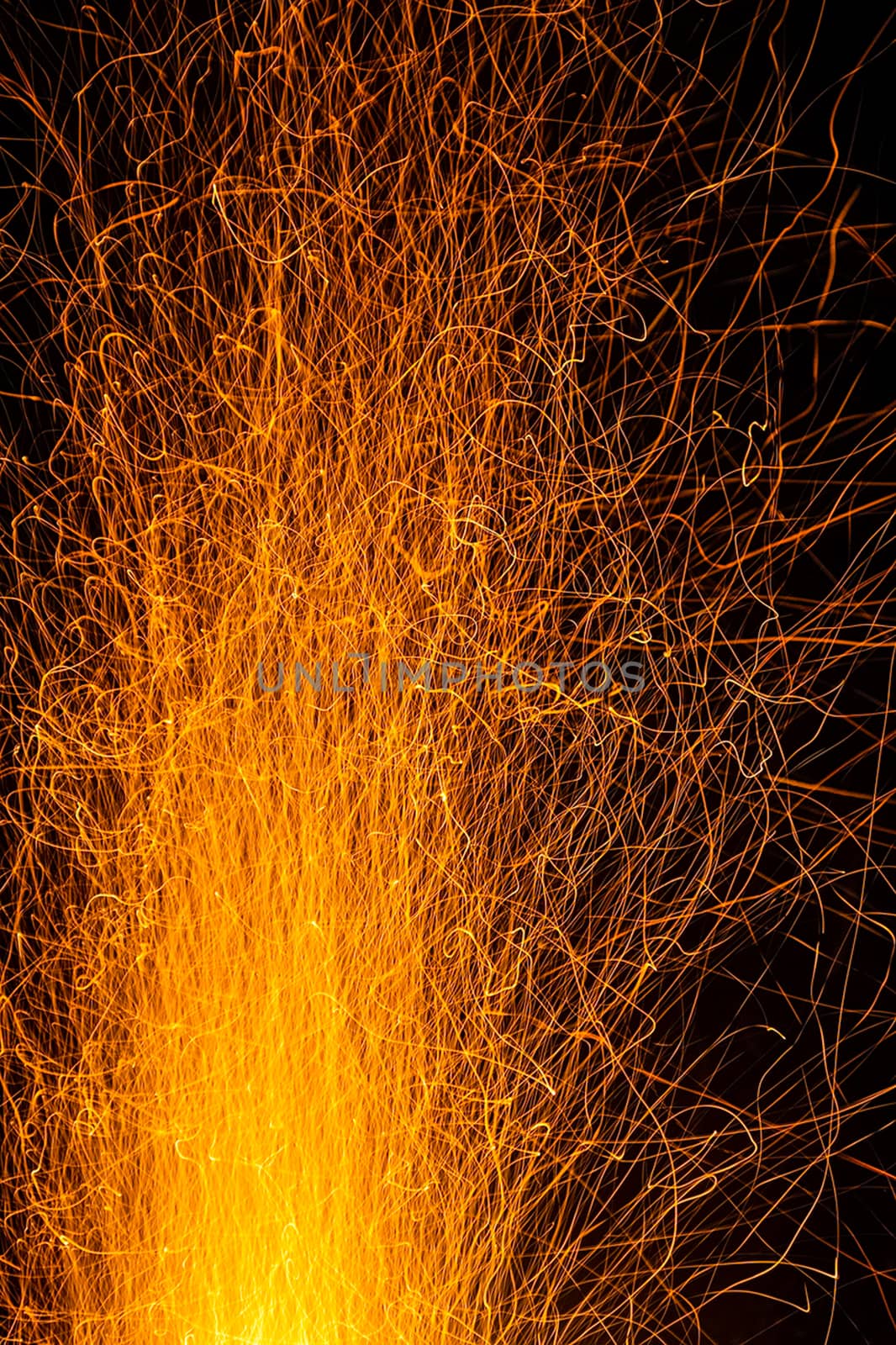 Sparks from a fire against a dark night. Bonfire