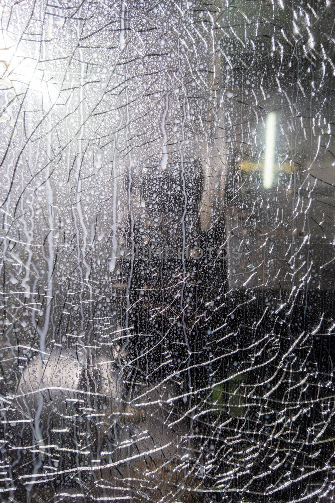 broken protective glass of cnc lathe - close-up full frame photo.