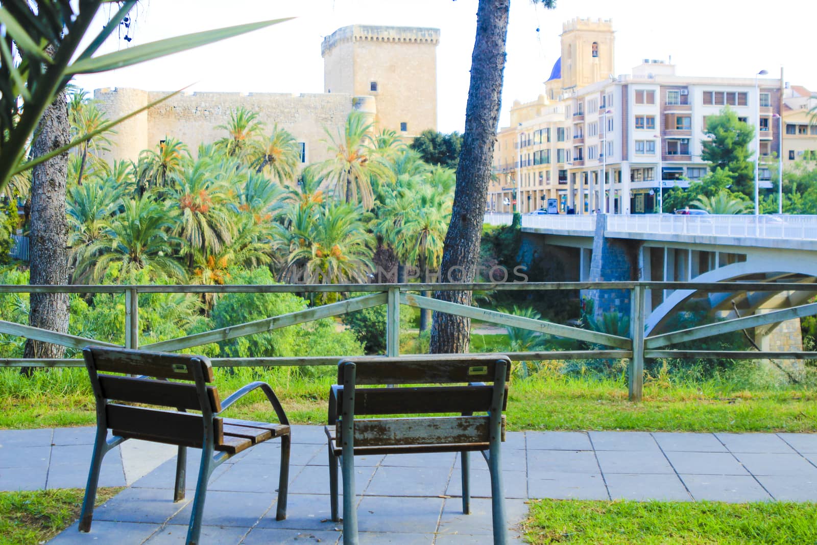 Elche, Alicante, Spain- November 16, 2020 - Landscape of the hillside of the Vinalopo River in Elche. Altamira Palace, Altamira bridge and Santa Maria church in the background