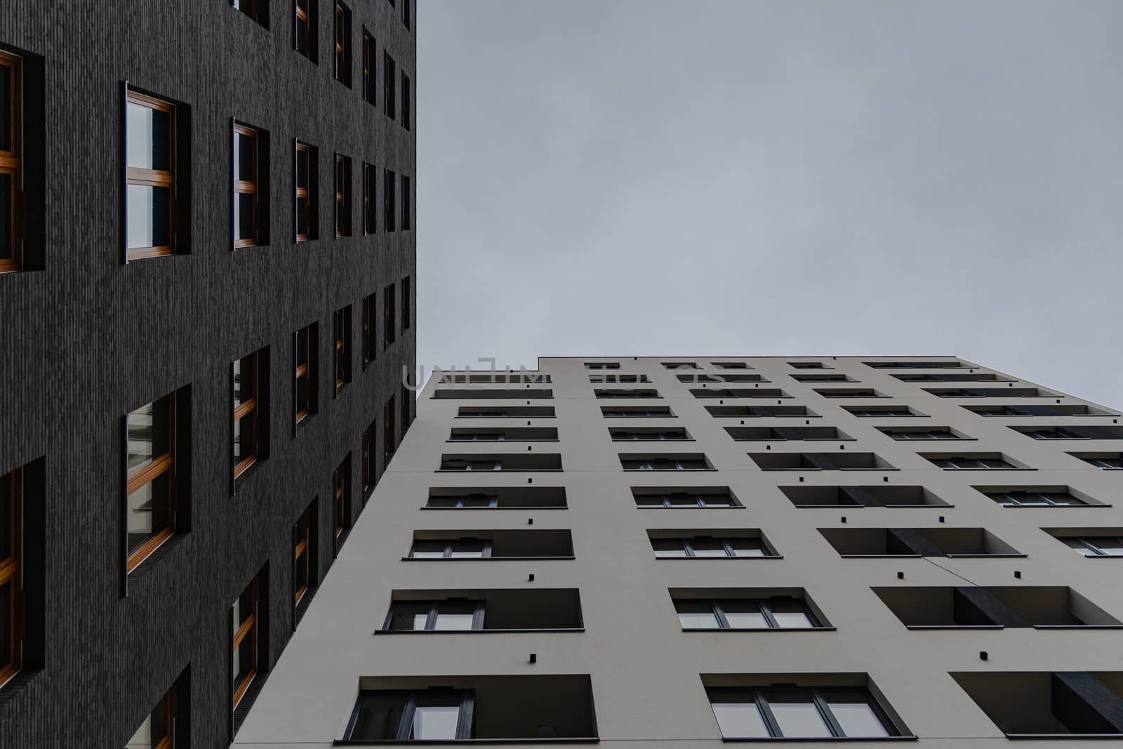 Upward view to high block of flats by Wierzchu