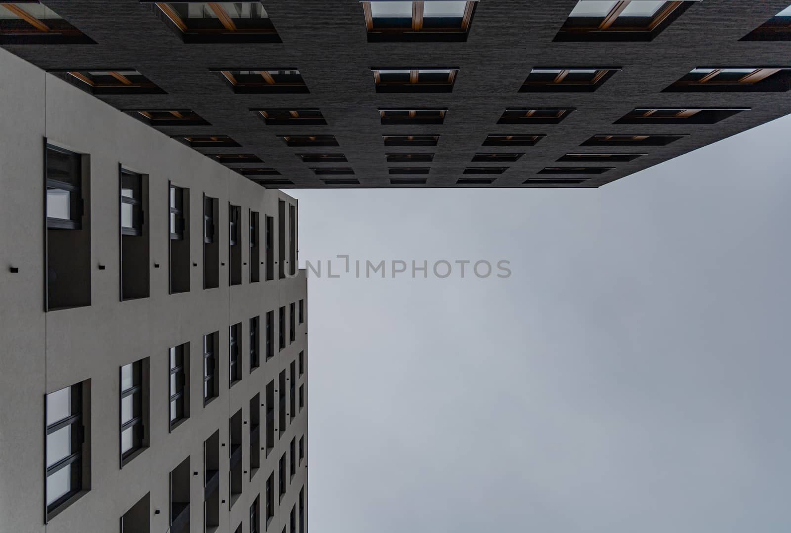 Upward view to high block of flats by Wierzchu