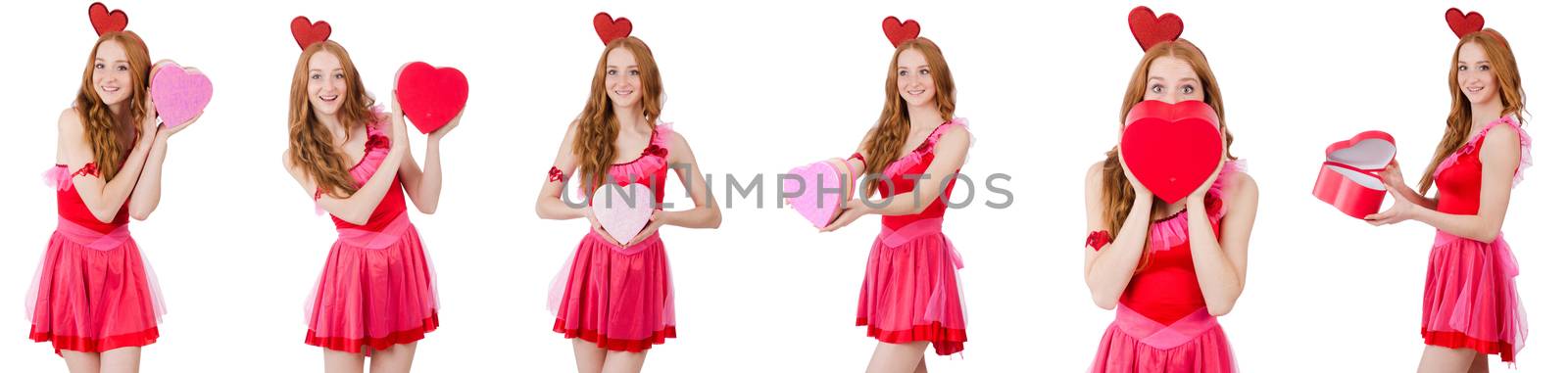 Pretty young model in mini pink dress holding gift box isolated on white
