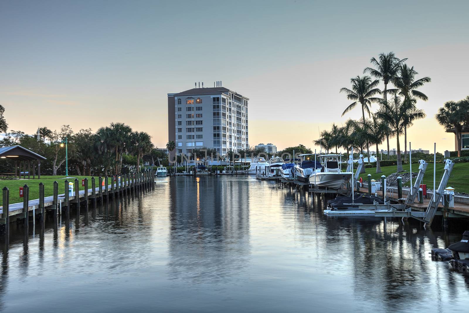 Cocohatchee River Park Marina boats lined up at sunset by steffstarr