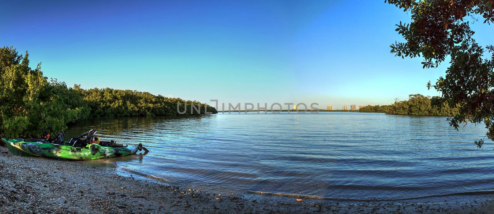 Fishing Kayak ready for launch on the shore of Estero Bay on Big Hickory Island in Bonita Springs, Florida.