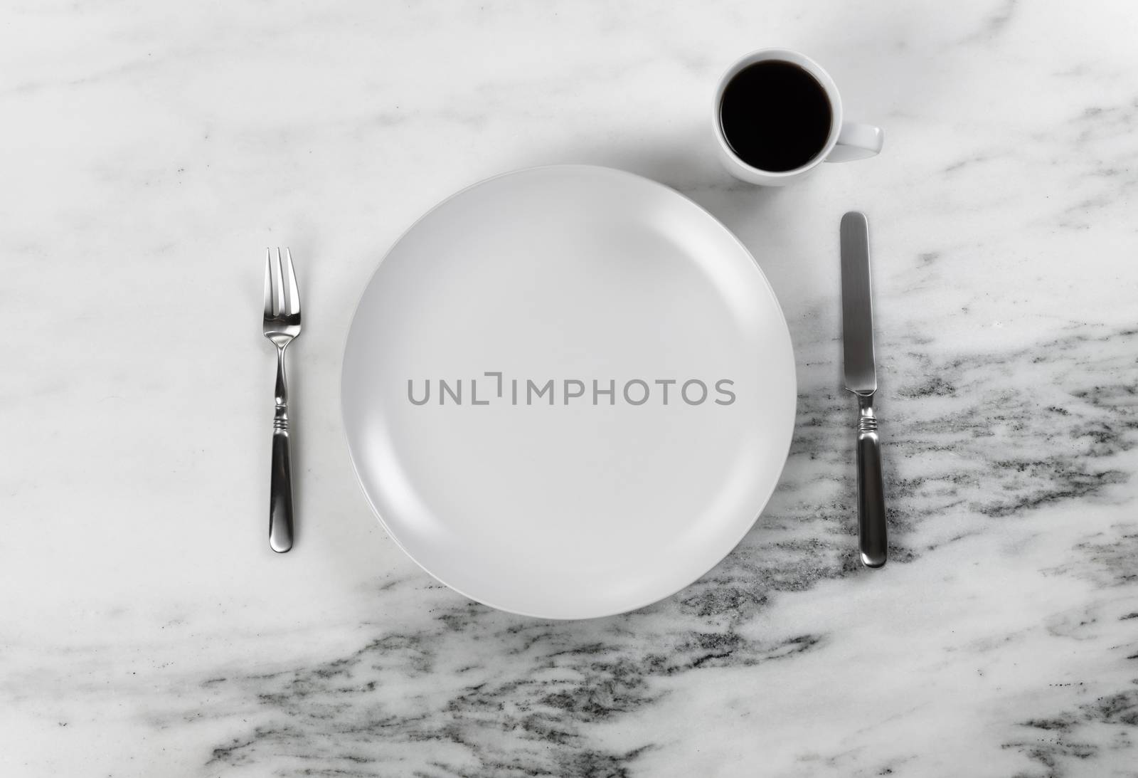 Fresh coffee plus table set for dinner with clean plate and uten by tab1962