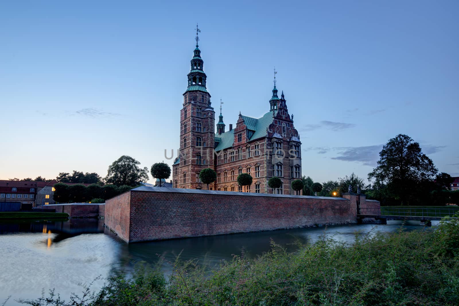Copenhagen, Denmark - August 19, 2019: Sunset view of the historic Rosenborg Castle.