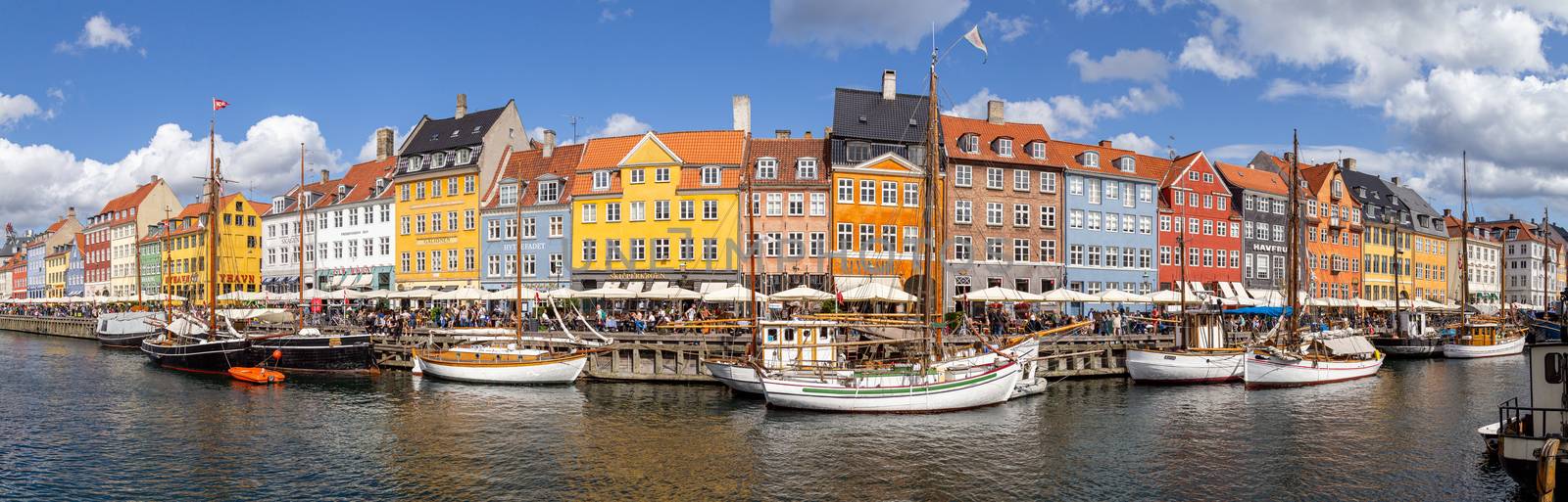 Copenhagen, Denmark - August 21, 2019: Panoramic view of the famous Nyhavn district in the city centre.