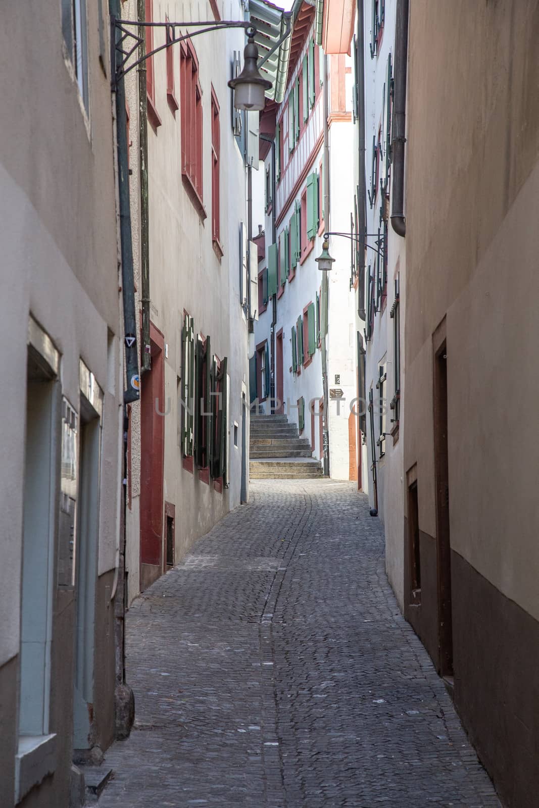 Basel, Switzerland - March 10, 2019: Old houses in an alley in the historic city centre of the swiss city Basel