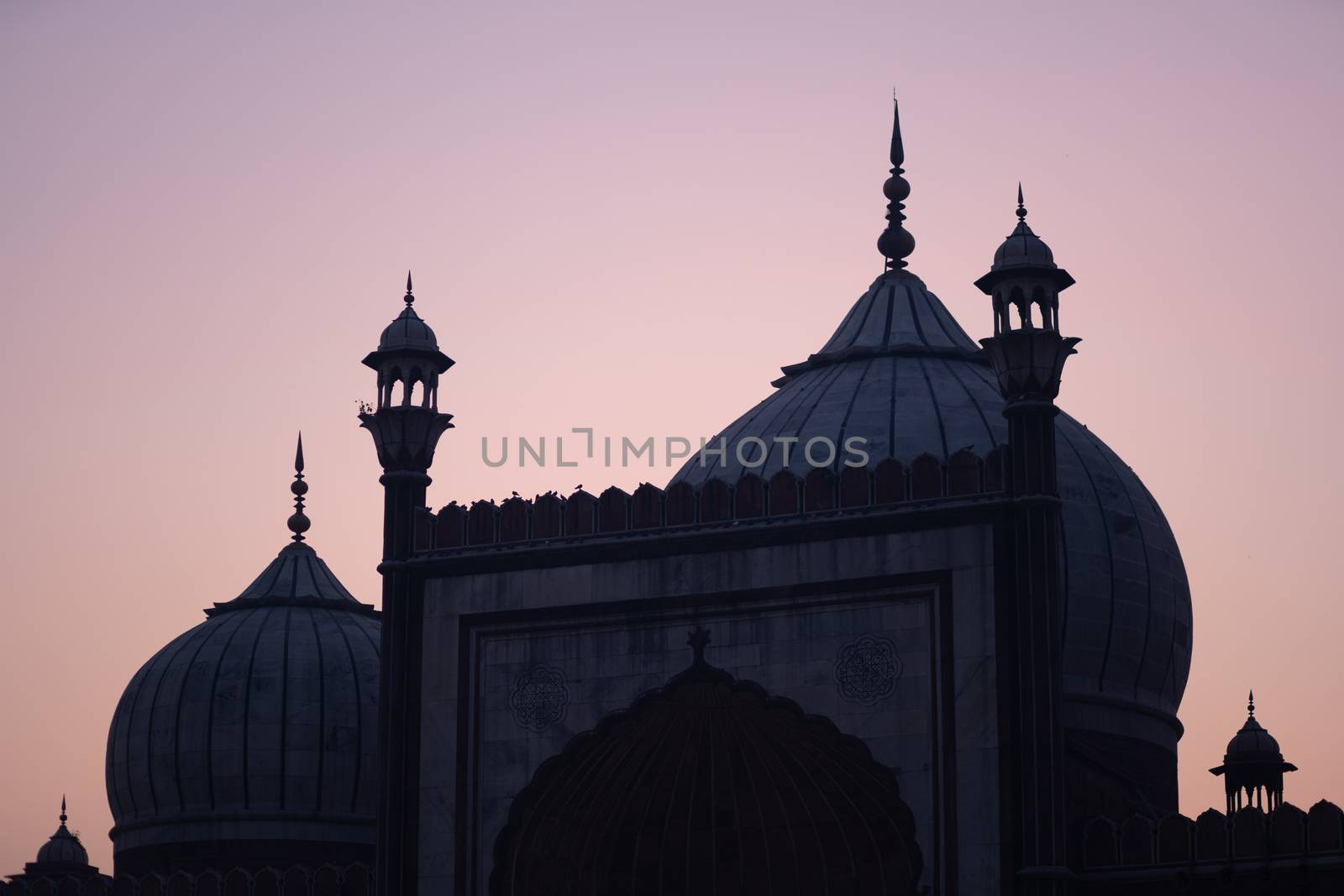 Delhi, India - December 04, 2019: Silhouette of historic Jama Masjid during sunset.
