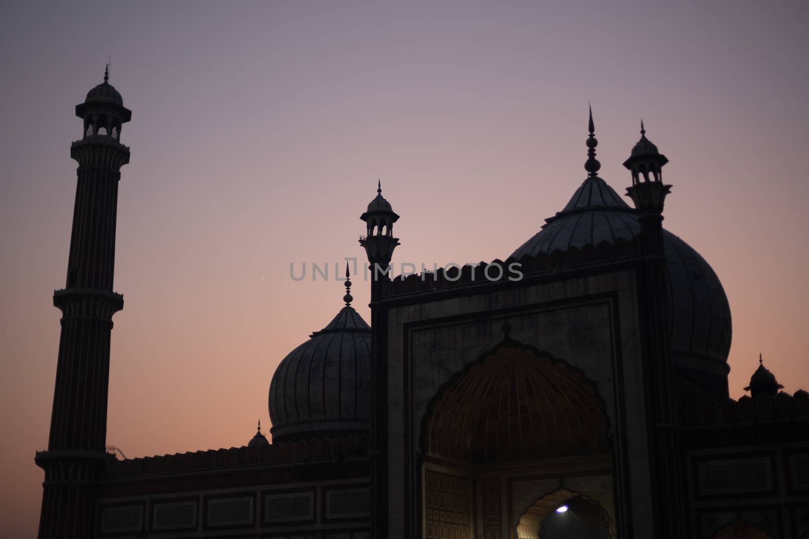 Delhi, India - December 04, 2019: Silhouette of historic Jama Masjid during sunset.