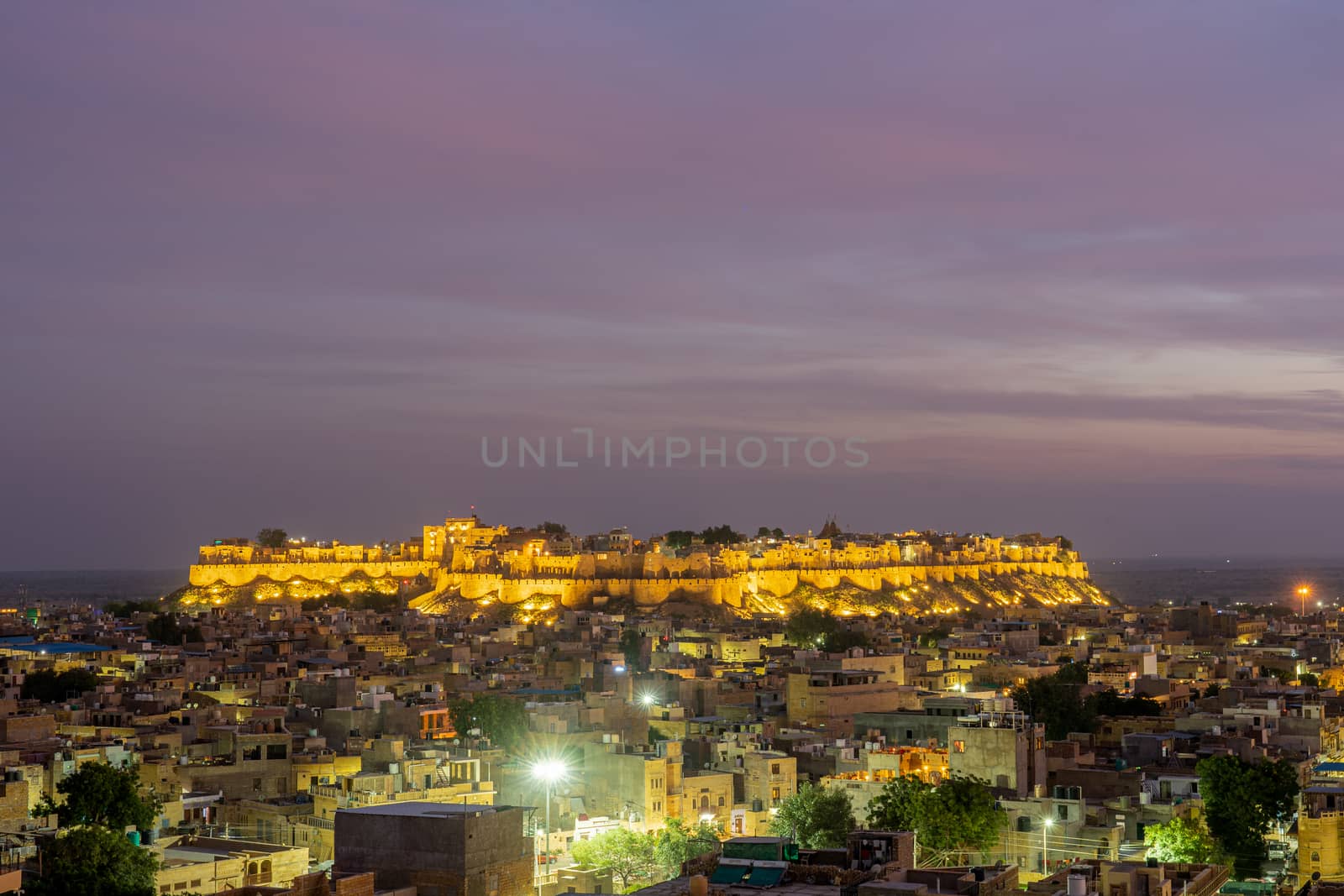 Jaisalmer, India - December 5, 2019: The illuminated Jaisalmer Fort during sunset.