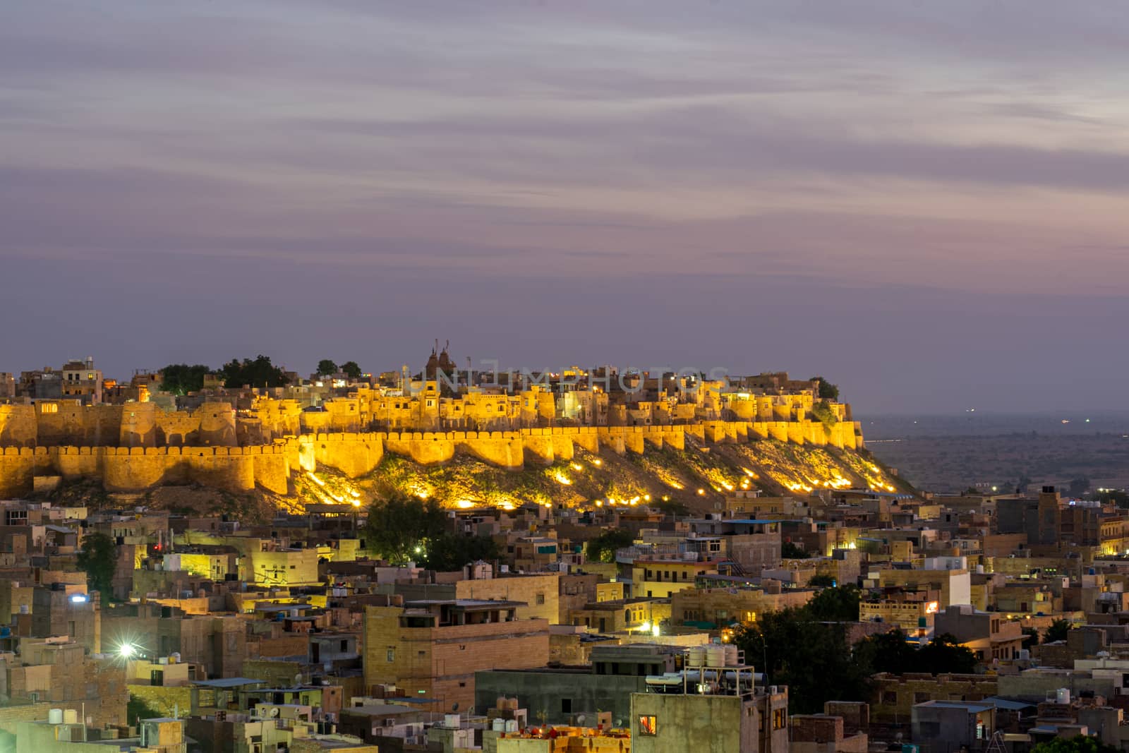 Jaisalmer, India - December 5, 2019: The illuminated Jaisalmer Fort during sunset.