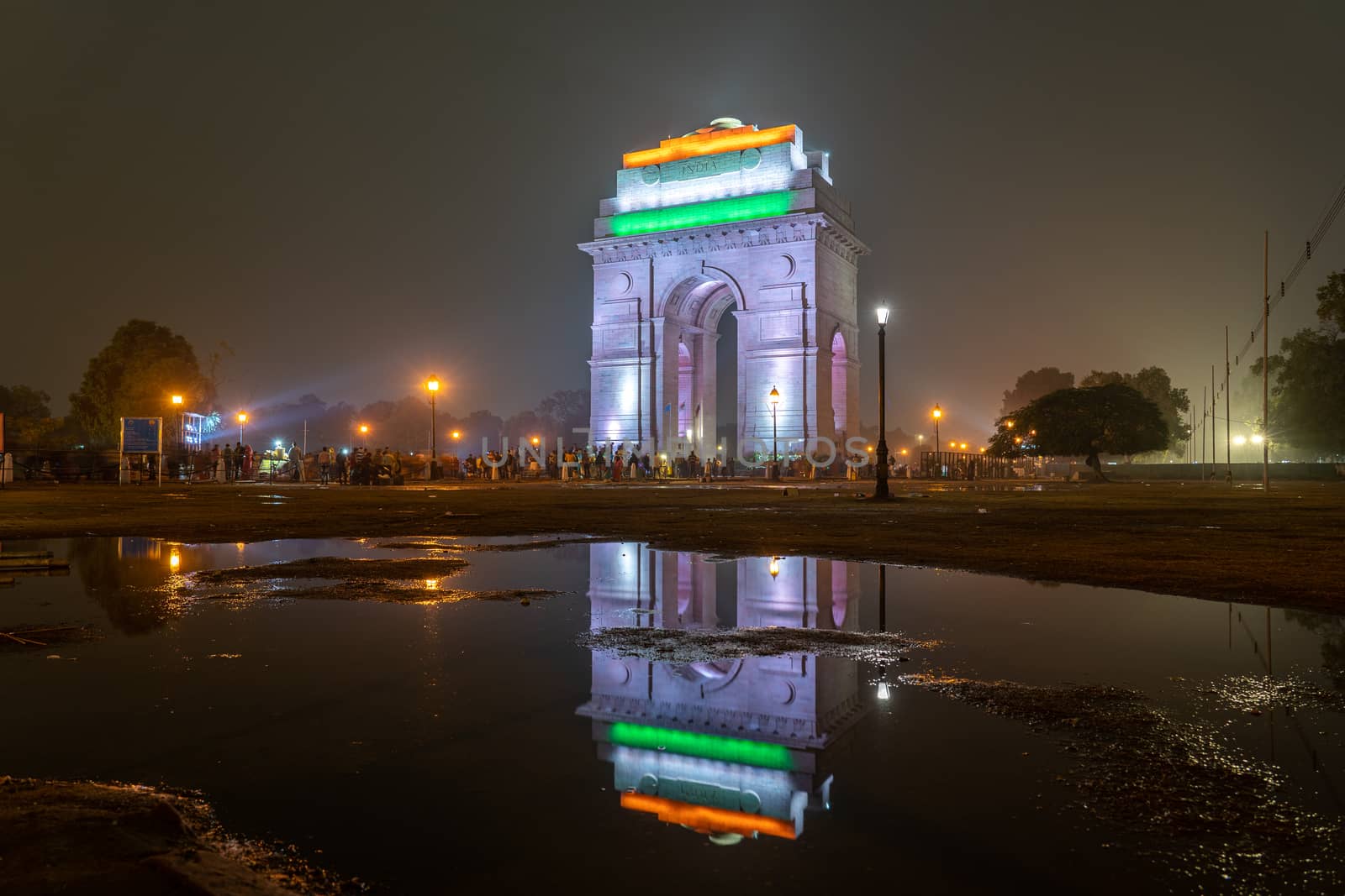 New Delhi, India - December 13, 2019: People in front of the illuminated India Gate at night