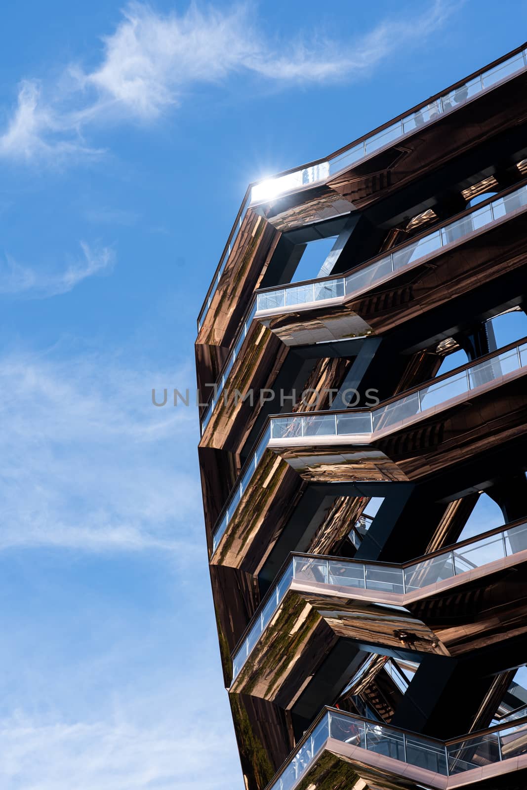 New York, United States - September 21, 2019: The Vessel, a spiral staircase landmark at Hudson Yards in Manhattan. Designed by architect Thomas Heatherwick in 2019.