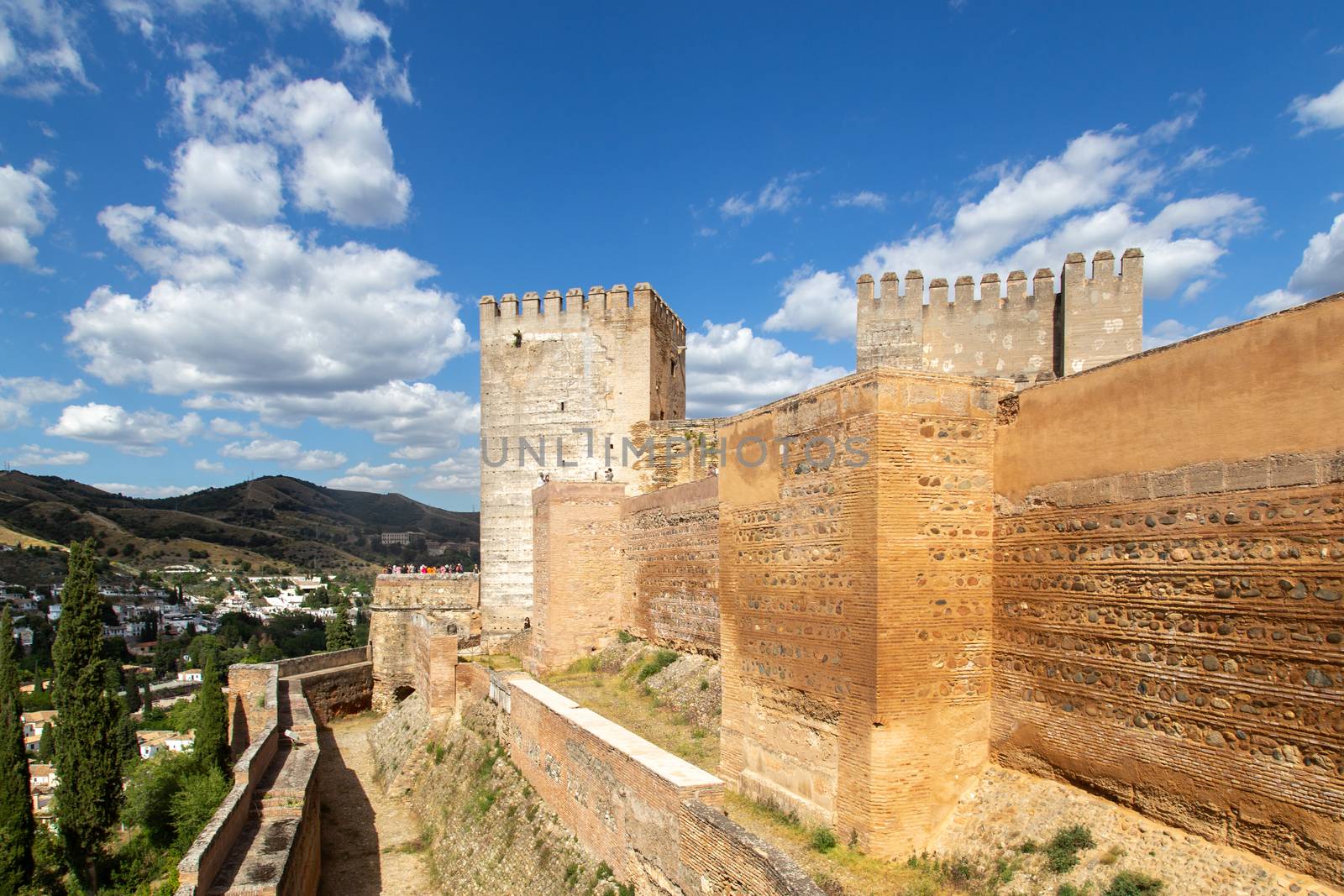 Granada, Spain - May 26, 2019: Exterior view of towers and walls at the famous Alhambra Palace