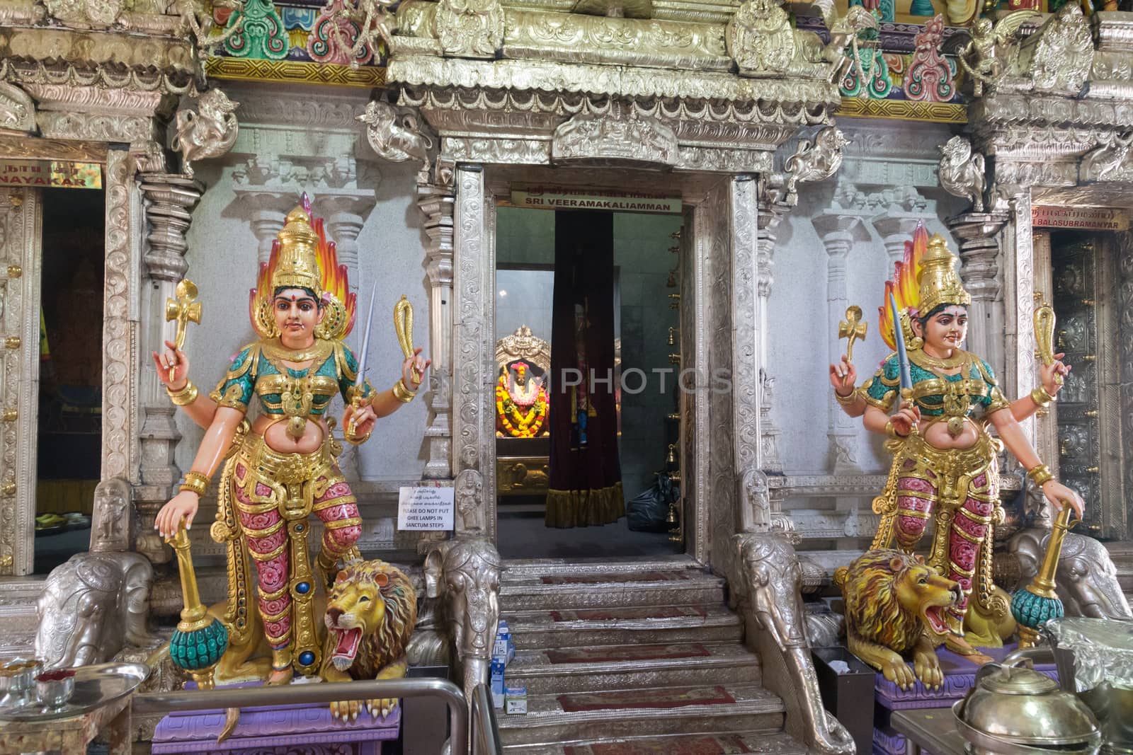 Singapore, Singapore - January 31, 2015: Statues at the entrance to the Hindu temple in the district Little India.