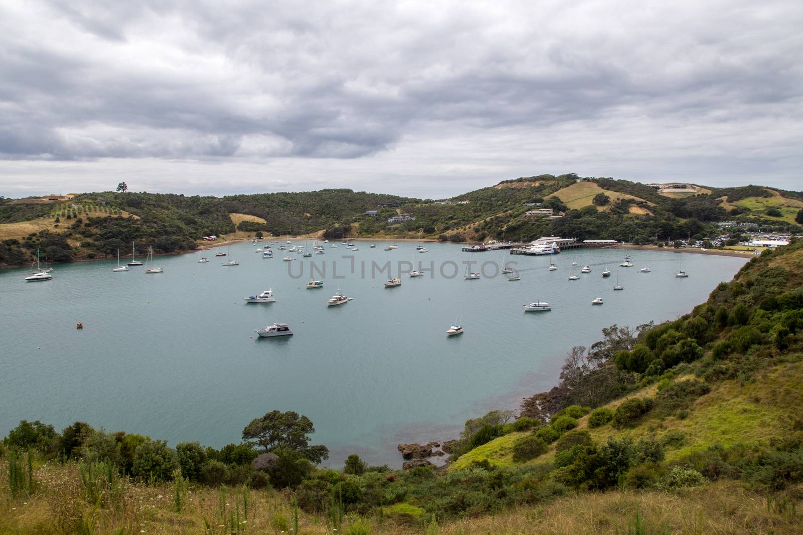 Waiheke Island, New Zealand - February 09, 2015: Yachts and sailing boats moored in Matiatia Bay