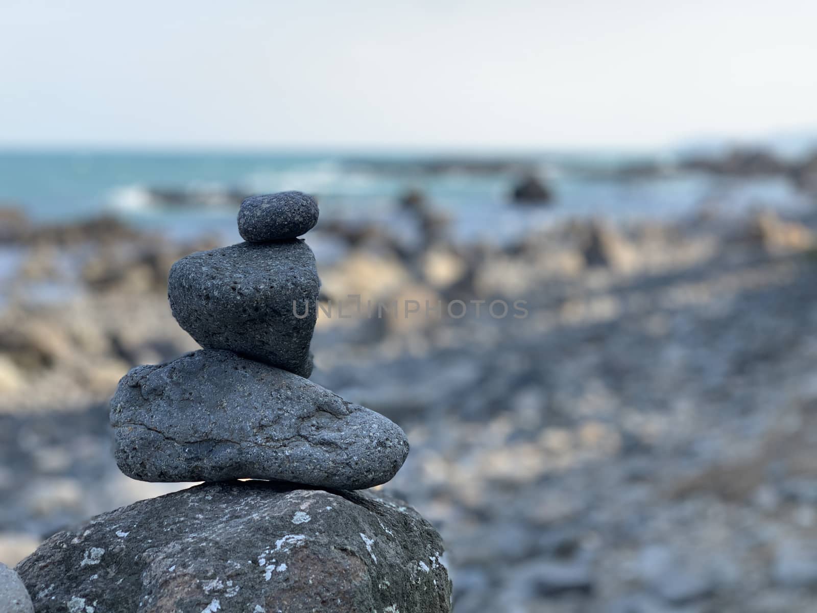 Zen stack of pebbles on the beach