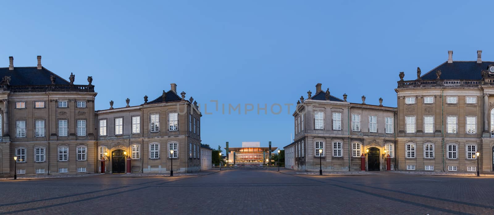 Copenhagen, Denmark - June 05, 2016: Evening photography of Amalienborg Palace and the opera house in the background