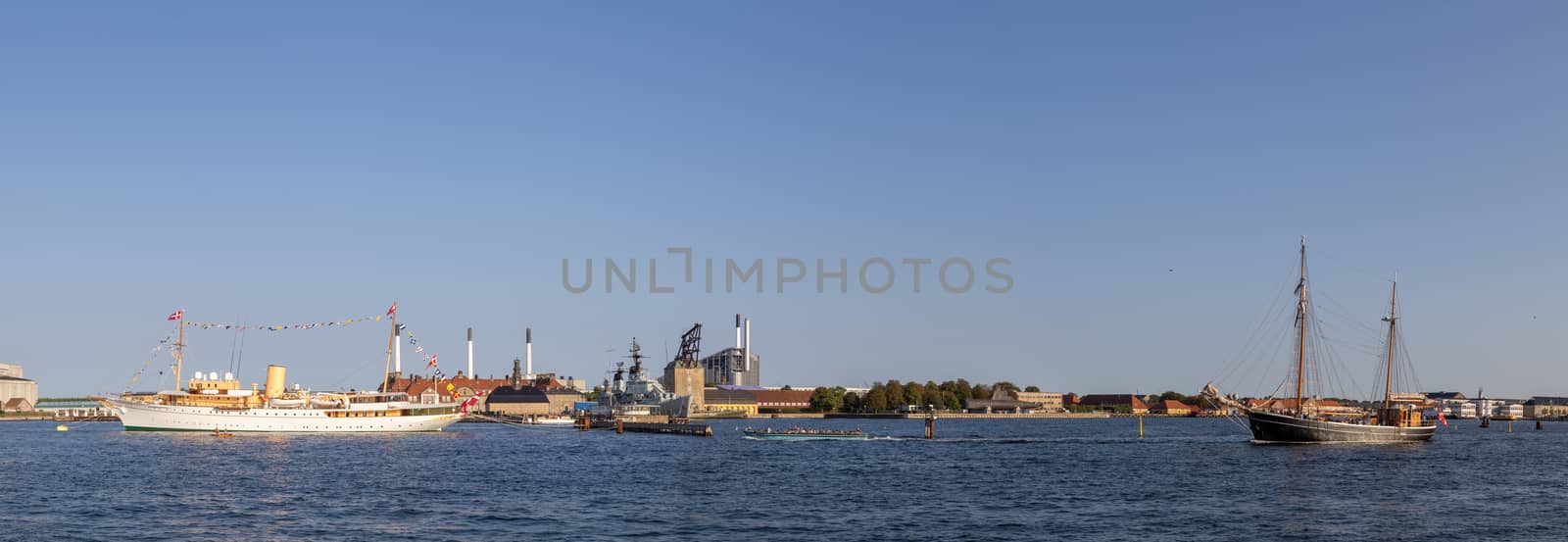 Copenhagen, Denmark - September 14, 2016: Panoramic harbor view with the royal yacht Dannebrog and a sailboat