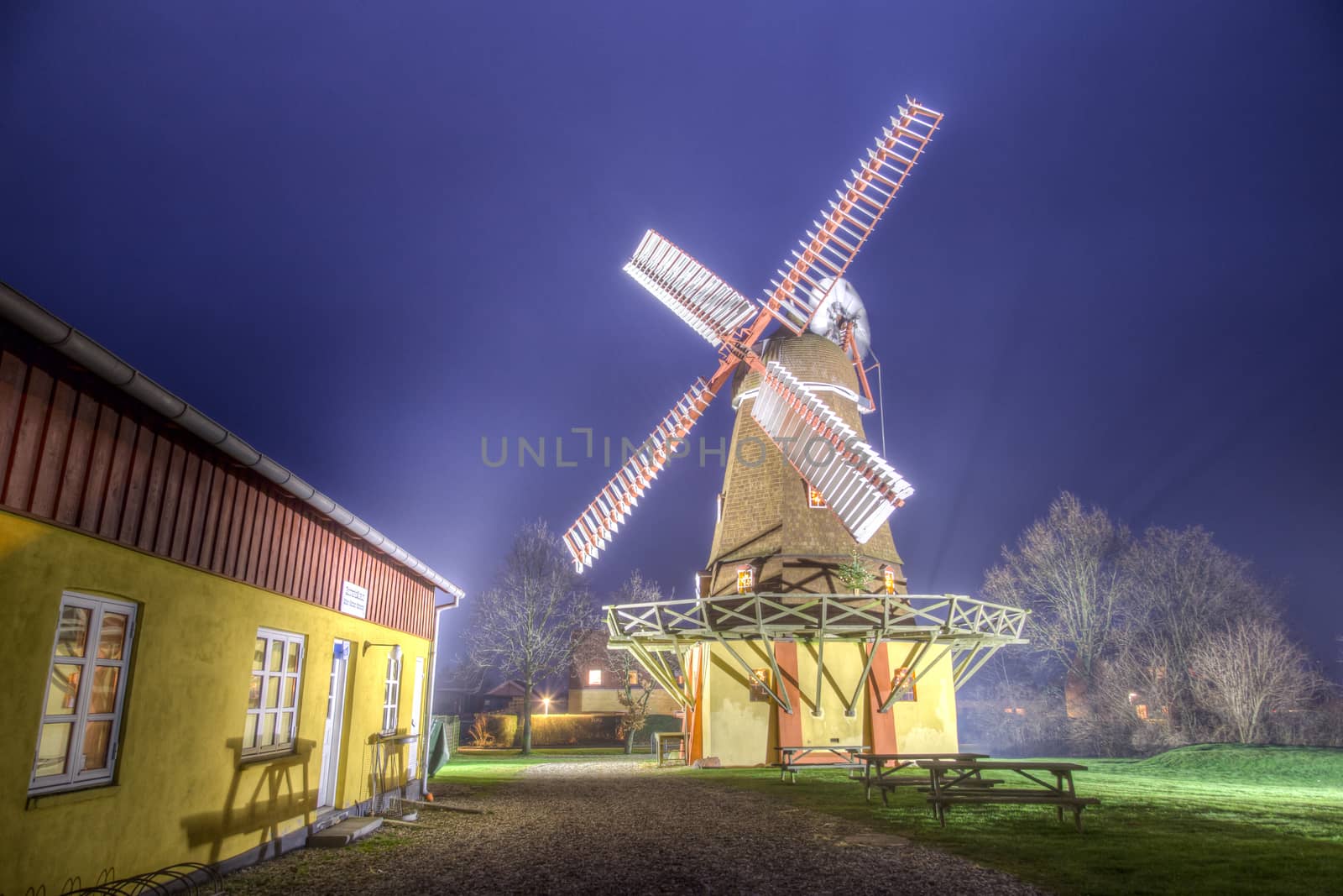 Ramloese, Denmark - December 30, 2016: HDR photo of an illuminated historic Danish windmill
