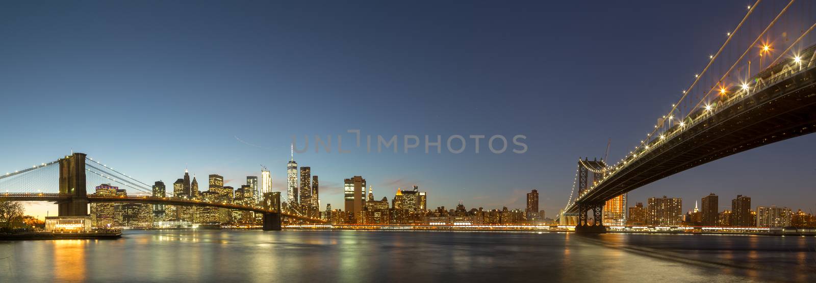 New York, United States of America - November 18, 2016: Skyline of Lower Manhattan and Brooklyn Bridge during sunset time