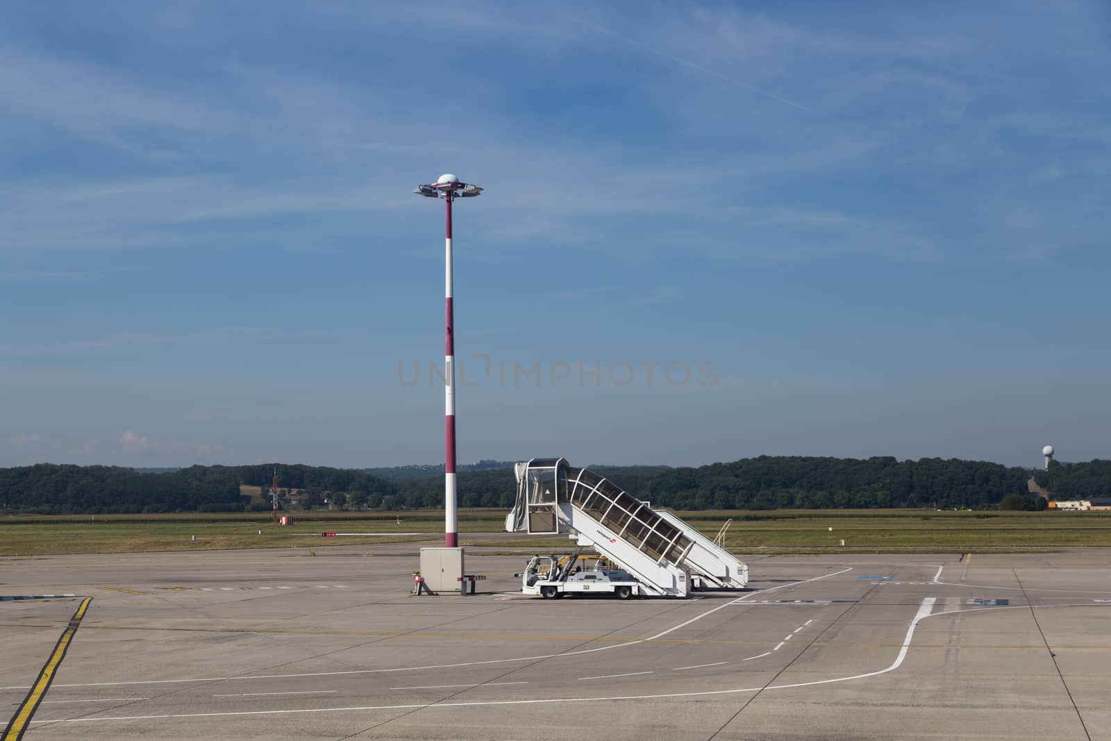 Basel, Switzerland - July 18, 2017: An airstair parked at the airport