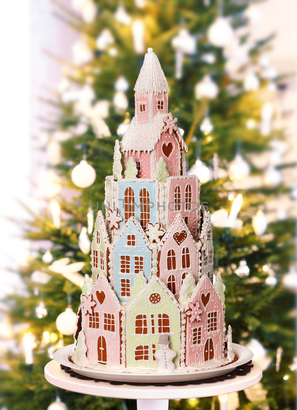 Gingerbread castle with Christmas tree home background by anterovium