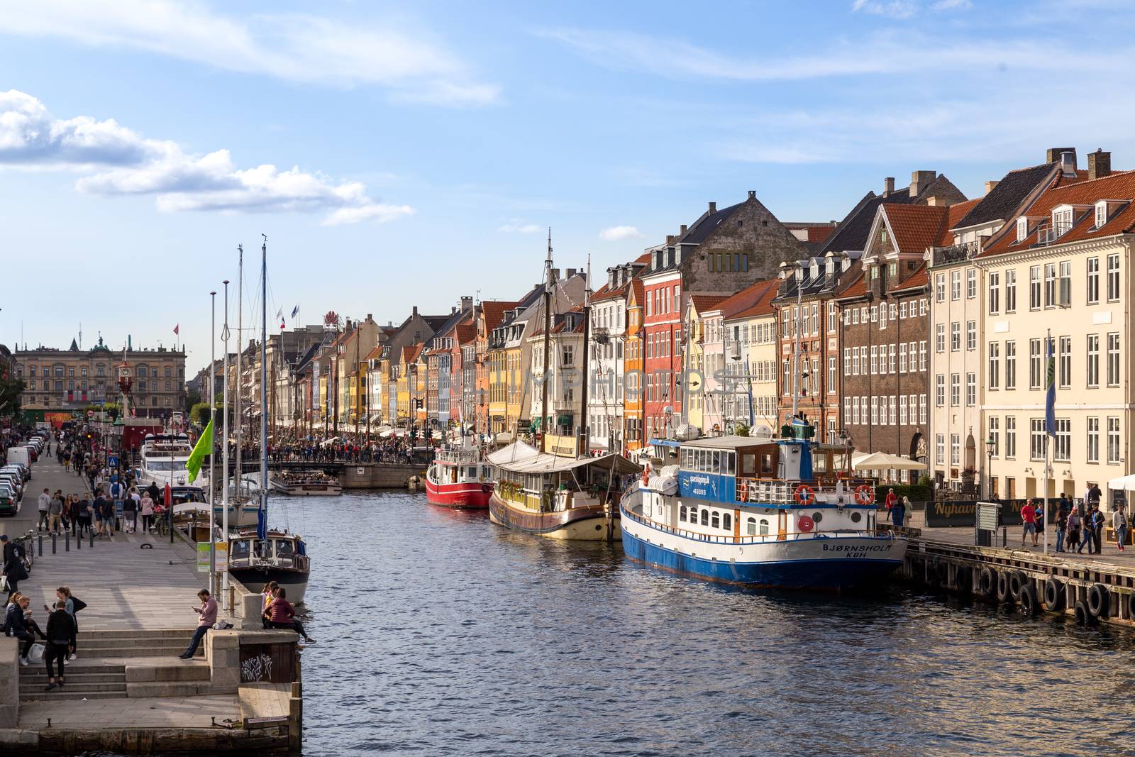 Copenhagen, Denmark - September 02, 2017: Famous Nyhavn harbor with boats in the historical city centre