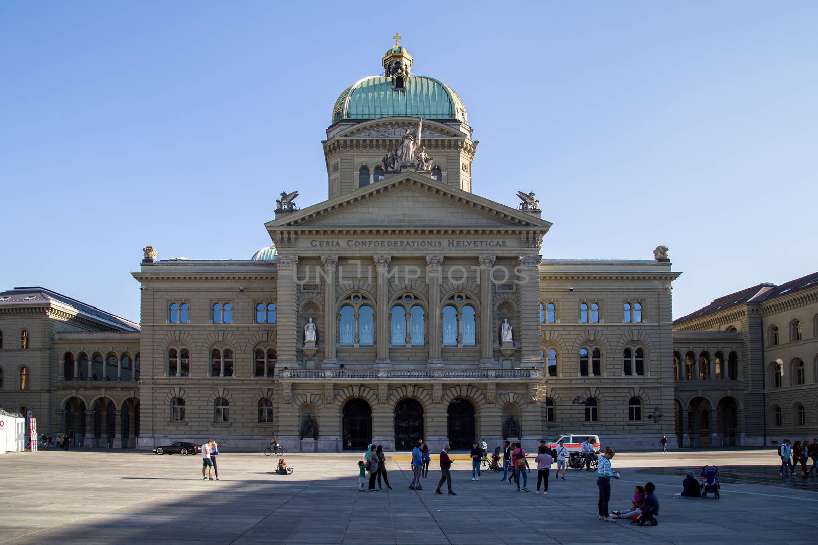 Berne, Switzerland - April 13, 2007: People infront of the Federal Palace in the historic city centre.