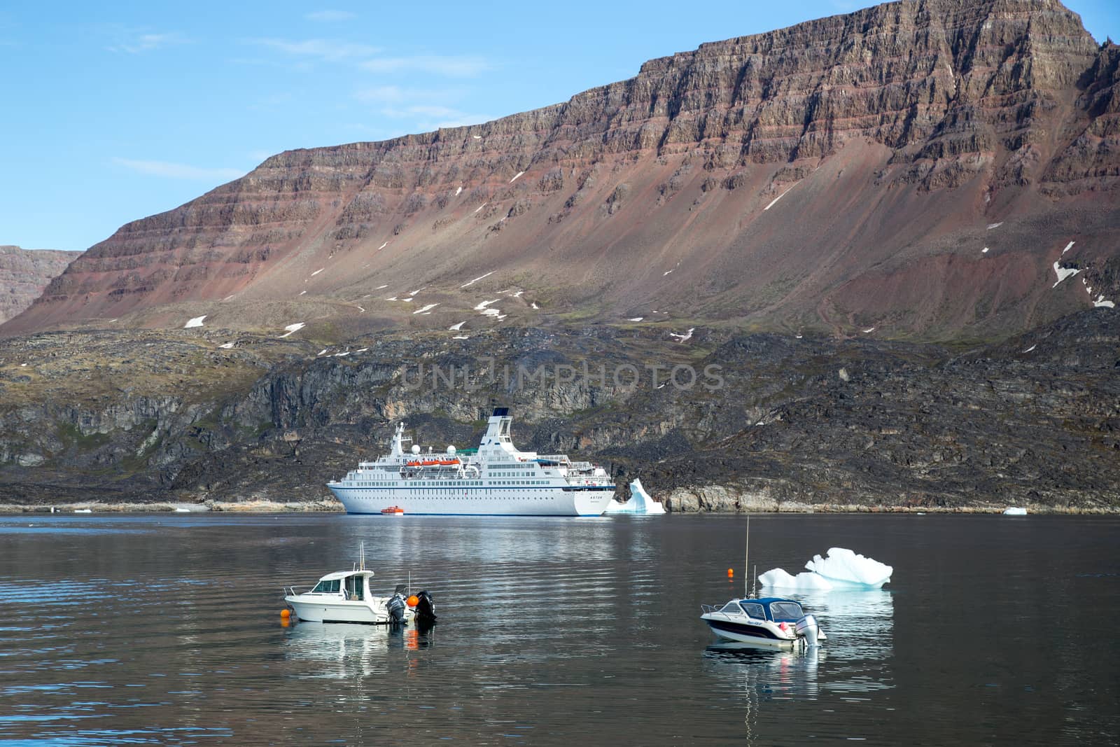 Cruise ship anchored at Qeqertarsuaq Harbor, Greenland by oliverfoerstner