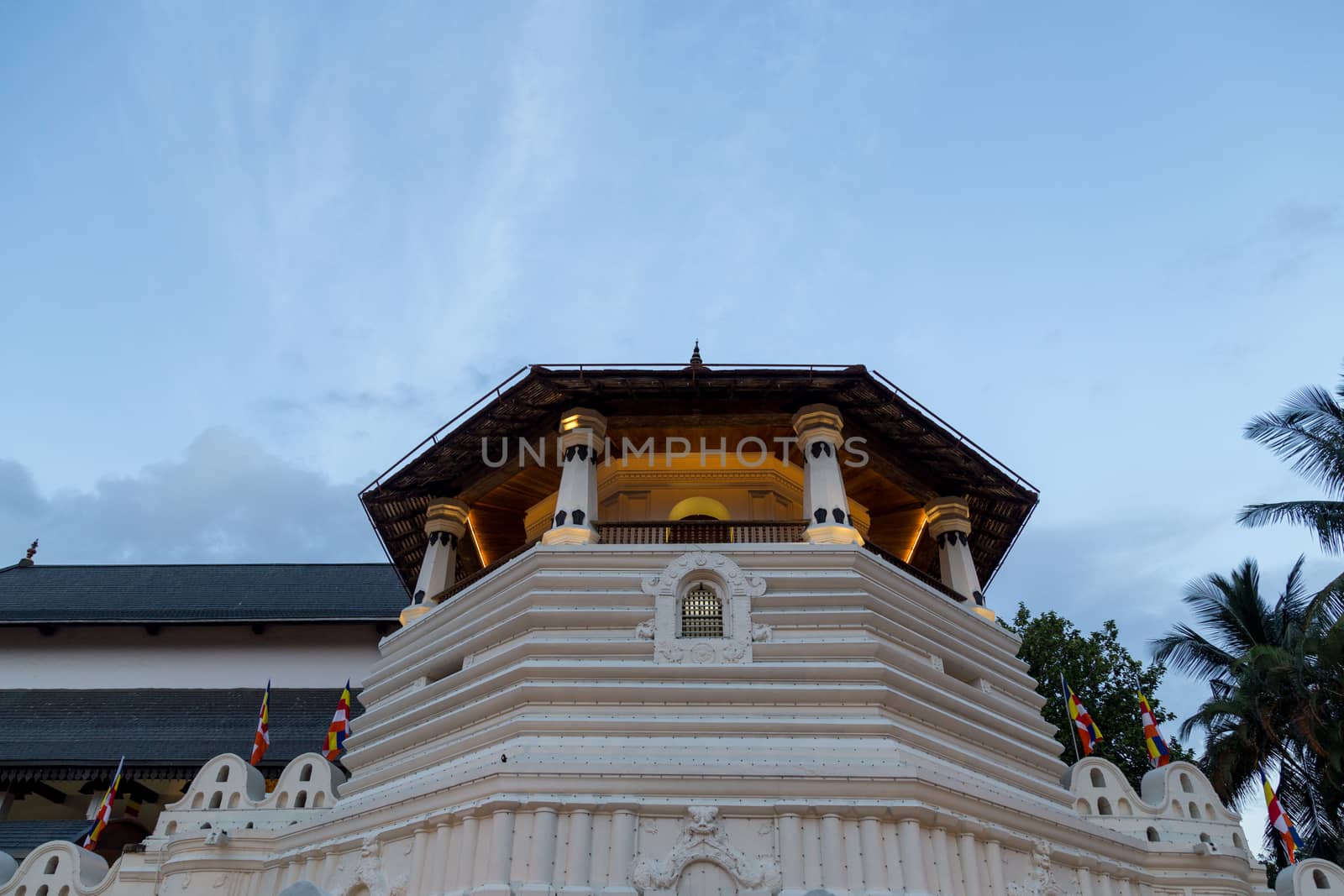 Kandy, Sri Lanka - August 9, 2018: The Temple of the sacred tooth relic, a Buddhist temple which is located in the royal palace complex of the former Kingdom of Kandy.