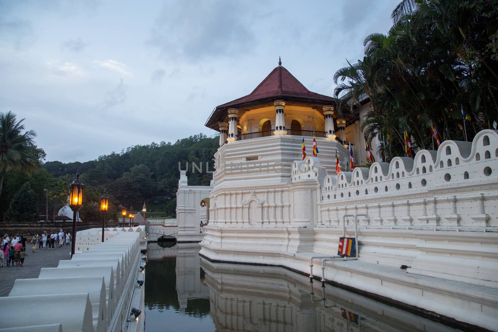 Kandy, Sri Lanka - August 9, 2018: The Temple of the sacred tooth relic, a Buddhist temple which is located in the royal palace complex of the former Kingdom of Kandy.