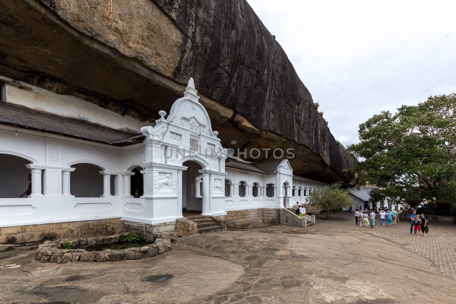 Dambulla, Sri Lanka - August 15, 2018: People in front of the Dambulla Cave Temple also known as the Golden Temple