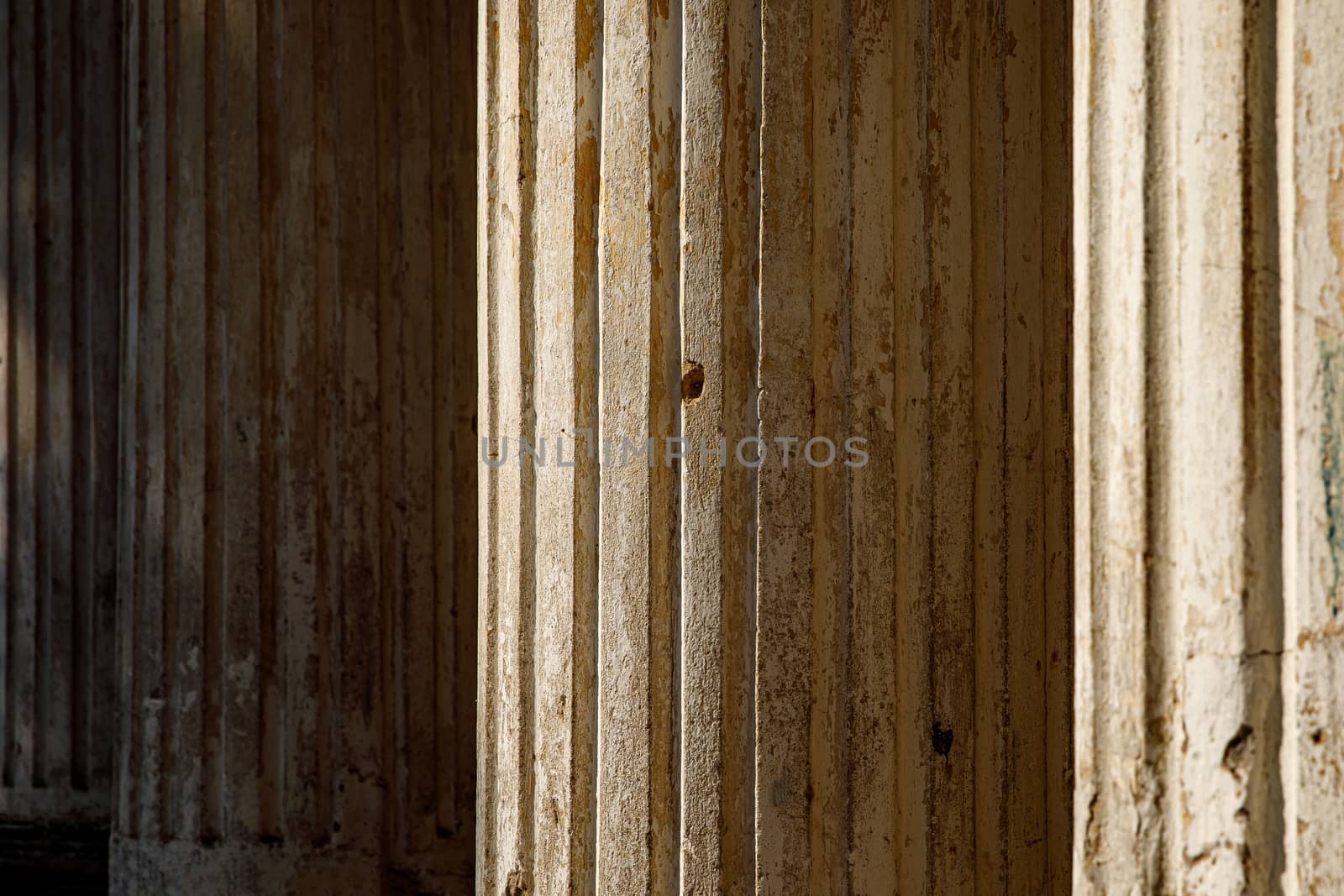 Ruined old columns on sunlight. by 9parusnikov