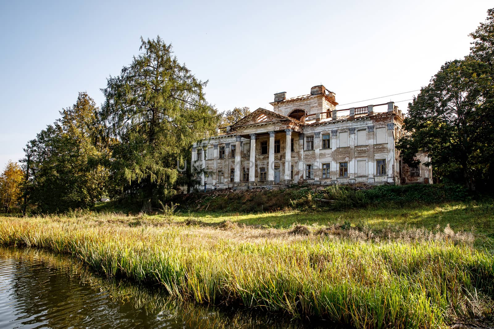 Old abandoned building with columns in nature