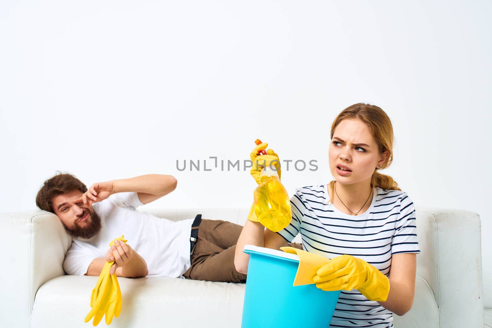 Married couple joint cleaning house cleaning supplies lifestyle. High quality photo