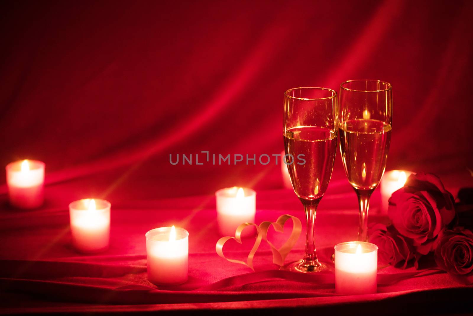 Valentines day background with champagne glasses roses candles and hearts