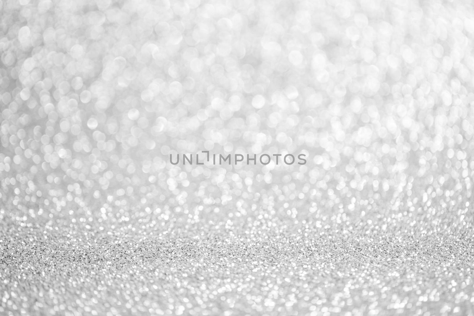 Shiny silver bokeh glitter lights abstract background, Christmas New Year party celebration concept