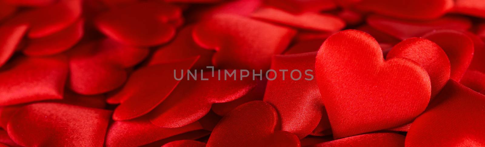 Valentine's day many red silk hearts background, love concept